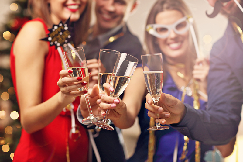 Party goers celebrate a new year with a new, healthier smile