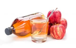 Apple cider vinegar in jar, glass and fresh apple